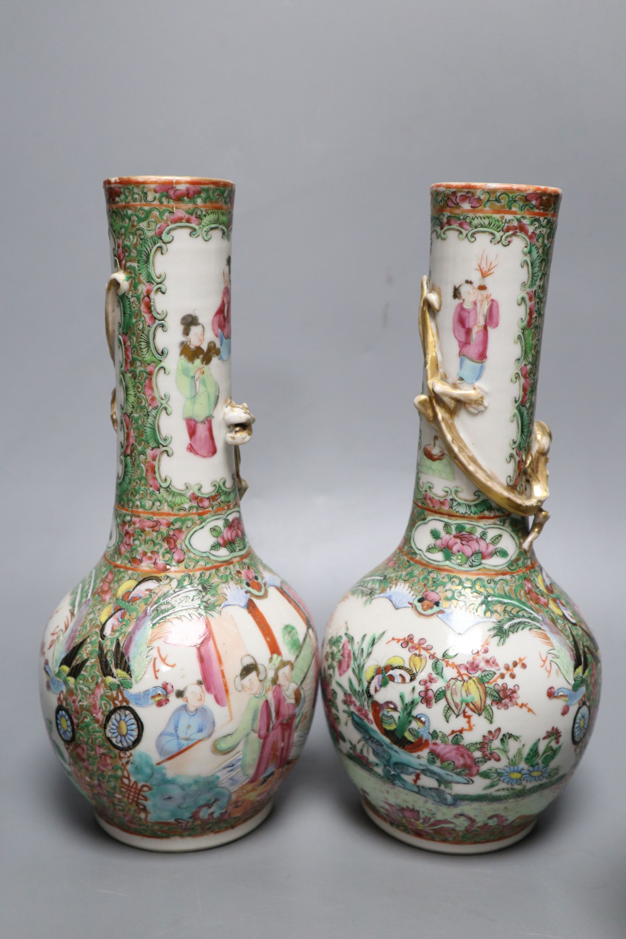 A pair of Chinese famille rose bottle vases, a similar teapot, vase and jar, 19th century, tallest 25cm